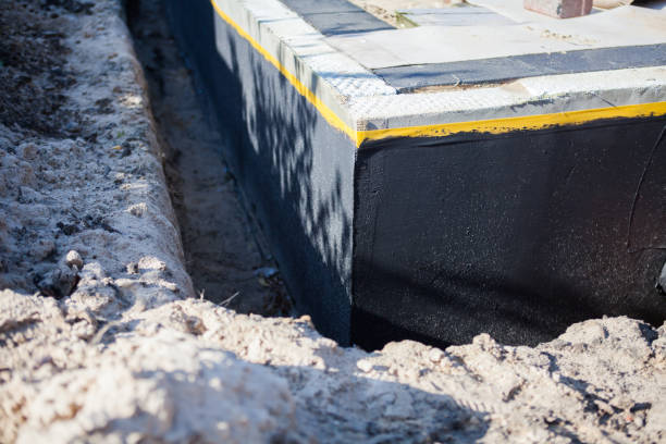 Professional Emergency Waterproofing technician working in Elmwood Park, NJ